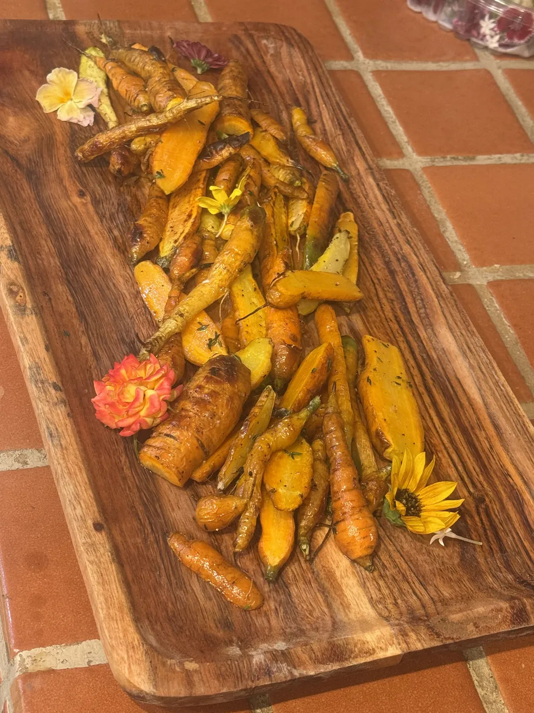 Braised carrots on a wooden board