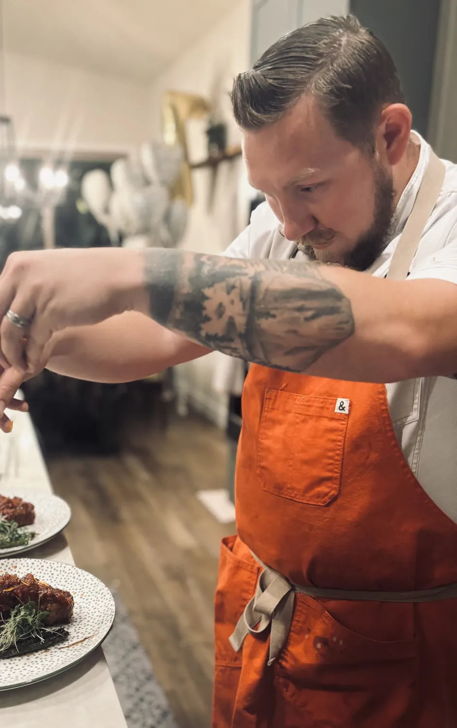 Wade finishing plates at the counter
